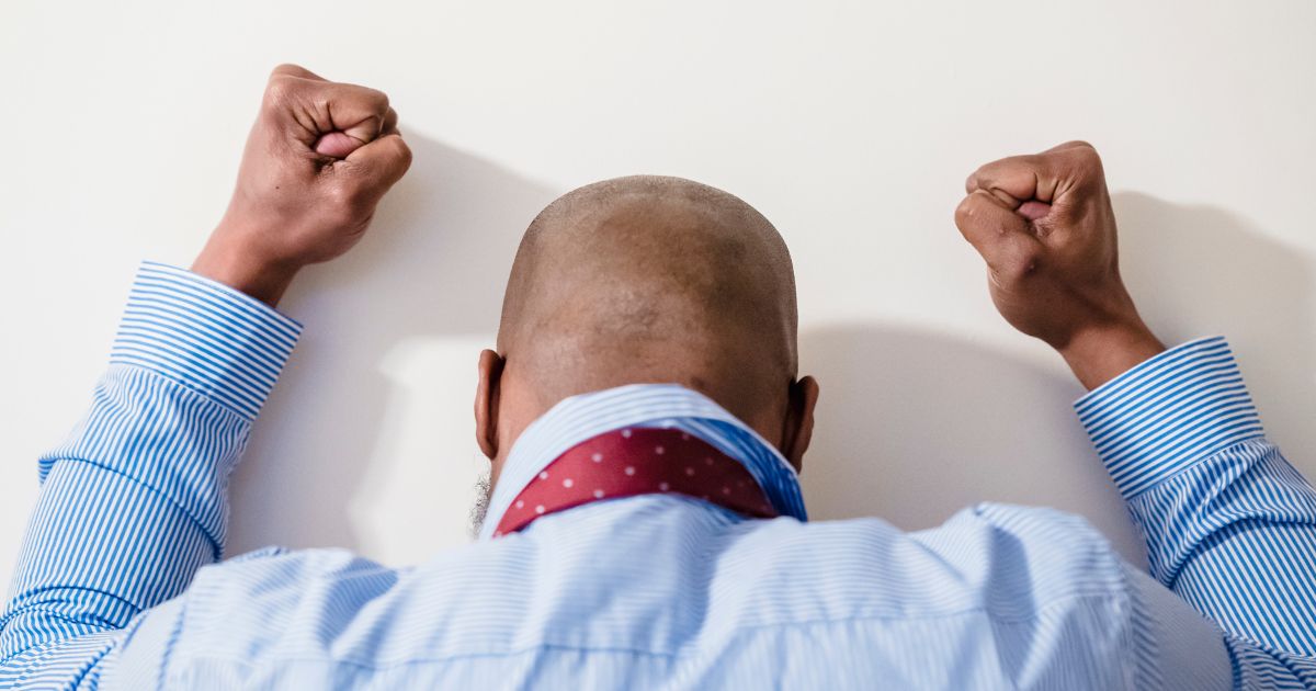 Person in visible frustration, reflecting the inner conflict that witnessing presence helps soften.